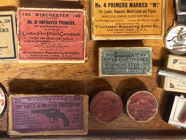 Vintage Winchester ammunition boxes and primer tins, including No. 2 Improved Primers and .32 Smith & Wesson cartridges
